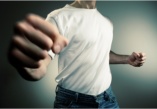 Man holding fist to camera